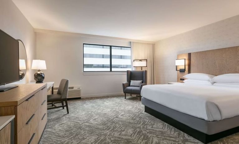 Spacious king size bed, TV and desk in a day use room at DoubleTree By Hilton Canton Downtown.