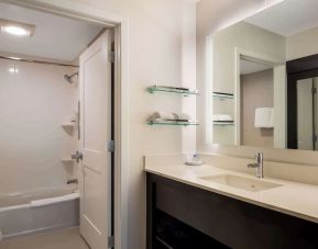 Private guest bathroom with combined shower and tub at Sonesta ES Suites Parsippany Morris Plains.