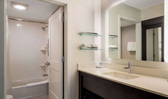 Private guest bathroom with combined shower and tub at Sonesta ES Suites Parsippany Morris Plains.