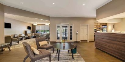 Lobby lounge with convenience store at Sonesta ES Suites Parsippany Morris Plains.