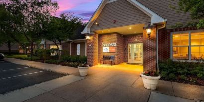 Hotel exterior and parking area at Sonesta ES Suites Parsippany Morris Plains.