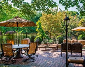 Beautiful hotel terrace with seating area at Sonesta Select Tinton Falls Eatontown.