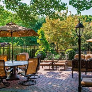 Beautiful hotel terrace with seating area at Sonesta Select Tinton Falls Eatontown.