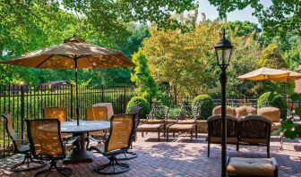 Beautiful hotel terrace with seating area at Sonesta Select Tinton Falls Eatontown.