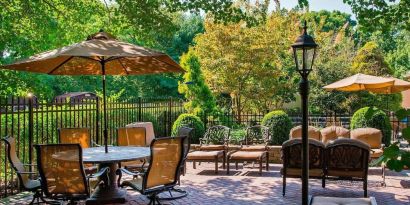 Beautiful hotel terrace with seating area at Sonesta Select Tinton Falls Eatontown.