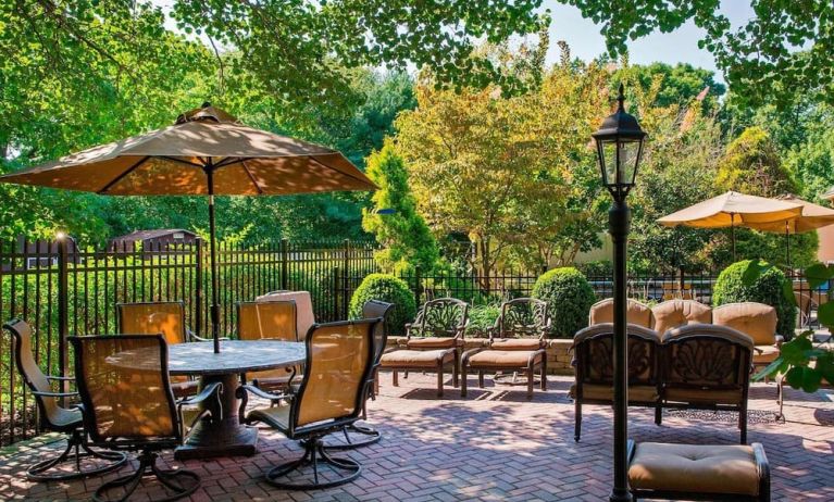 Beautiful hotel terrace with seating area at Sonesta Select Tinton Falls Eatontown.
