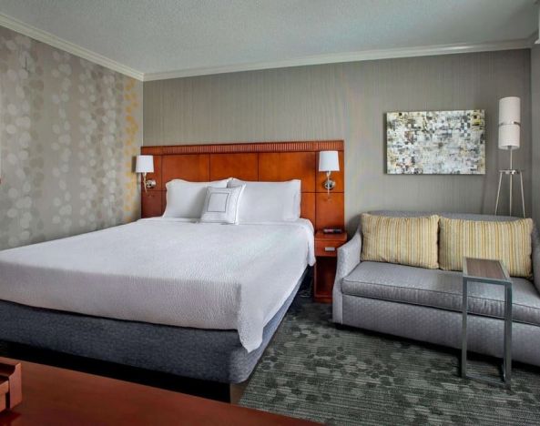 King bed at Sonesta Select Tinton Falls Eatontown.