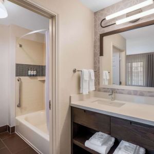 Private guest bathroom with combined shower and tub at Sonesta ES Suites Austin The Domain Area.