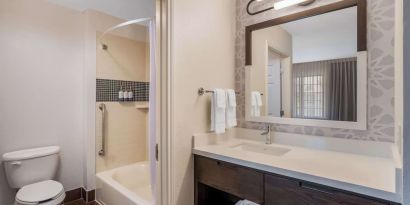 Private guest bathroom with combined shower and tub at Sonesta ES Suites Austin The Domain Area.