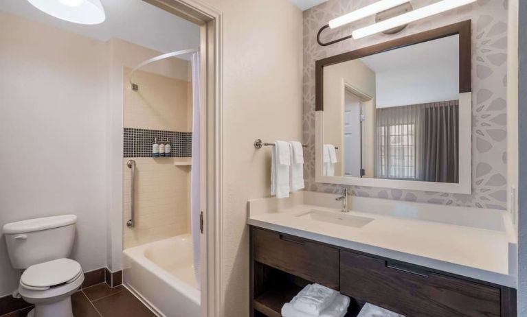 Private guest bathroom with combined shower and tub at Sonesta ES Suites Austin The Domain Area.