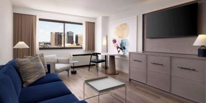 Room workspace with living area at Sonesta White Plains Downtown.