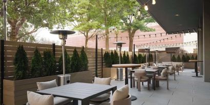 Hotel terrace with seating area, perfect for coworking at Sonesta White Plains Downtown.