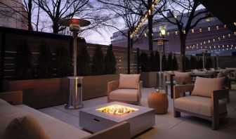 Patio with lounge seating and fire pit at Sonesta White Plains Downtown.