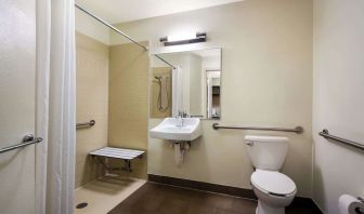 Accessible private guest bathroom with shower at Sonesta Simply Suites St Louis Earth City.