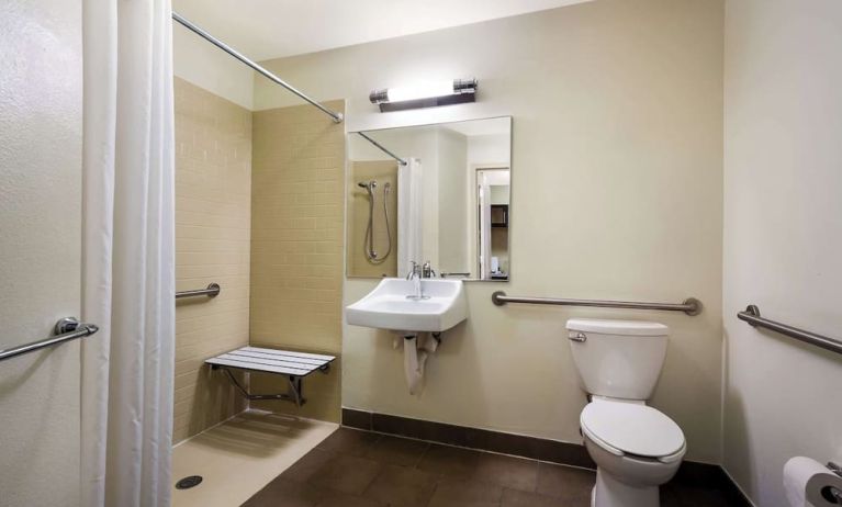 Accessible private guest bathroom with shower at Sonesta Simply Suites St Louis Earth City.