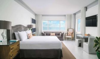Bright and spacious day use room with workspace and lounge seating at Nautilus Sonesta Miami Beach.