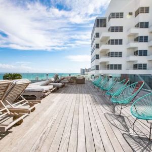 Terrace with lounge seating at Nautilus Sonesta Miami Beach.
