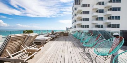 Terrace with lounge seating at Nautilus Sonesta Miami Beach.