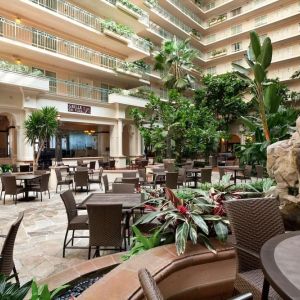 Breakfast area with natural light perfect for coworking at Embassy Suites By Hilton San Francisco Airport Waterfront.