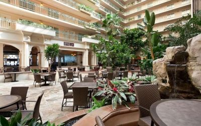 Breakfast area with natural light perfect for coworking at Embassy Suites By Hilton San Francisco Airport Waterfront.