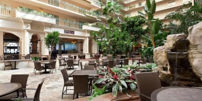 Breakfast area with natural light perfect for coworking at Embassy Suites By Hilton San Francisco Airport Waterfront.