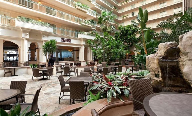Breakfast area with natural light perfect for coworking at Embassy Suites By Hilton San Francisco Airport Waterfront.