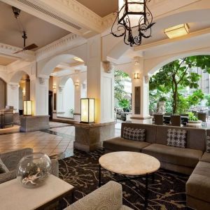 Lobby and coworking lounge at Embassy Suites By Hilton San Francisco Airport Waterfront.