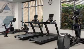 Fitness center with natural light at Hilton Garden Inn Fort Worth Medical Center.