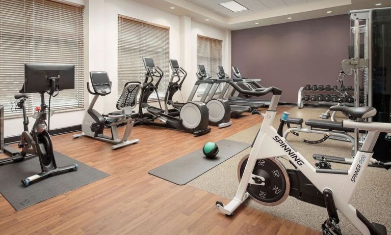 Well-equipped fitness center at Embassy Suites By Hilton Birmingham.