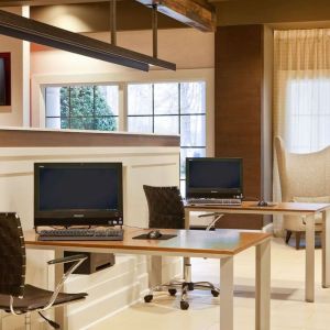 Business center with computers, printer and comfortable seating at Sonesta Atlanta Airport South.