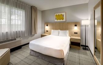 King bed at Sonesta Simply Suites Miami Airport Doral.