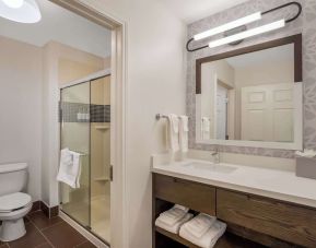 Private guest bathroom with shower and free toiletries at Sonesta ES Suites Denver South - Park Meadows.