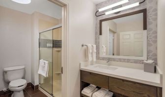 Private guest bathroom with shower and free toiletries at Sonesta ES Suites Denver South - Park Meadows.