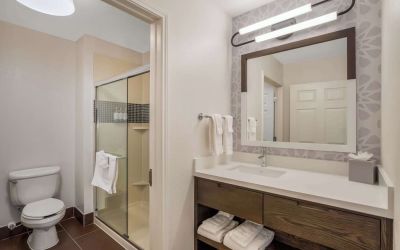 Private guest bathroom with shower and free toiletries at Sonesta ES Suites Denver South - Park Meadows.