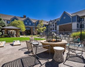 Patio with lounge seating and fire pit at Sonesta ES Suites Denver South - Park Meadows.