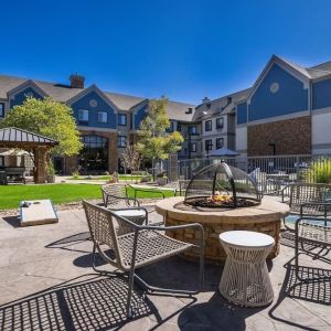 Patio with lounge seating and fire pit at Sonesta ES Suites Denver South - Park Meadows.