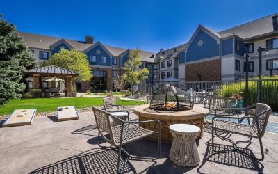 Patio with lounge seating and fire pit at Sonesta ES Suites Denver South - Park Meadows.