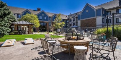 Patio with lounge seating and fire pit at Sonesta ES Suites Denver South - Park Meadows.