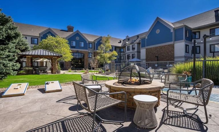 Patio with lounge seating and fire pit at Sonesta ES Suites Denver South - Park Meadows.