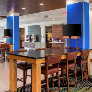 Dining area with comfortable seating perfect for coworking at Holiday Inn Express & Suites Yorkville.