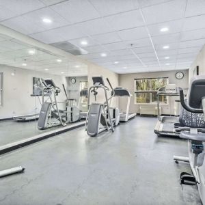Well equipped fitness center at Country Inn & Suites By Radisson, Chicago O'Hare South.