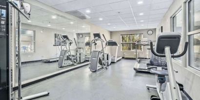Well equipped fitness center at Country Inn & Suites By Radisson, Chicago O'Hare South.