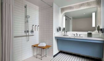 Accessible guest bathroom with shower at Sonesta Los Angeles Airport LAX.