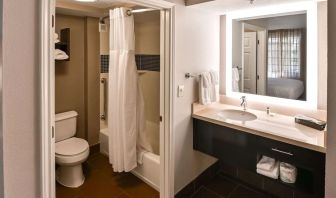 Private guest bathroom with combined shower and tub at Sonesta ES Suites San Antonio Northwest - Medical Center.