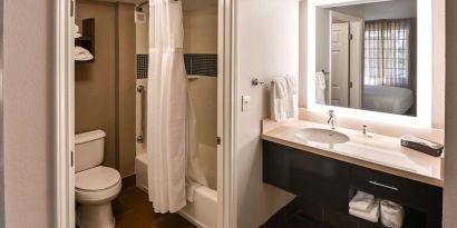 Private guest bathroom with combined shower and tub at Sonesta ES Suites San Antonio Northwest - Medical Center.