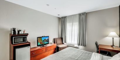 King room with TV at Quality Inn & Suites Liberty Lake - Spokane Valley.