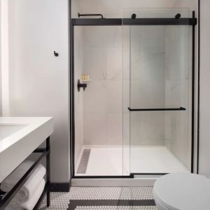 Private guest bathroom with shower at The Clift Royal Sonesta.