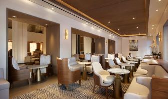 The hotel’s Living Room is furnished with comfortable seating and small tables, where guests can socialize, co-work, or have a drink.