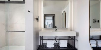 Private guest bathroom with shower at The Clift Royal Sonesta.