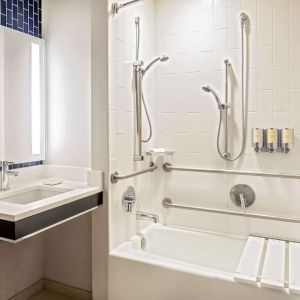 Private guest bathroom with combined shower and tub at Royal Sonesta Boston.
